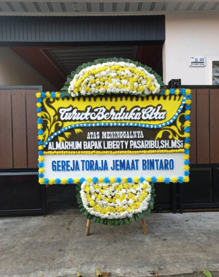 Papan Bunga Duka di Waesama